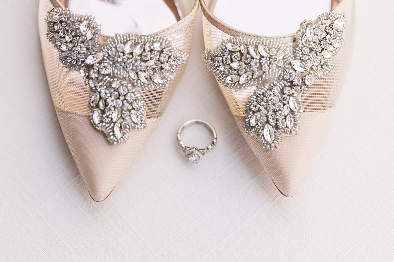 Wedding photography by Diana Gramlich, Badgley Mischka beige birdal shoes with rhinestones and wedding ring