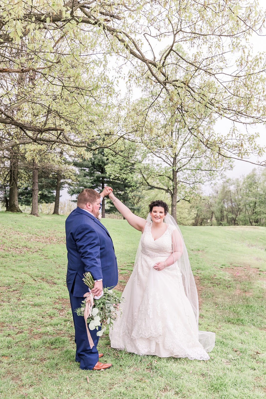 Wedding photography by Diana Gramlich, Bride twirling while groom looking at her